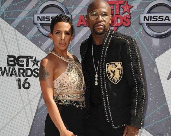 Devion Cromwell parents, Melissa Brim and Floyd Mayweather are posing in the BET awards.